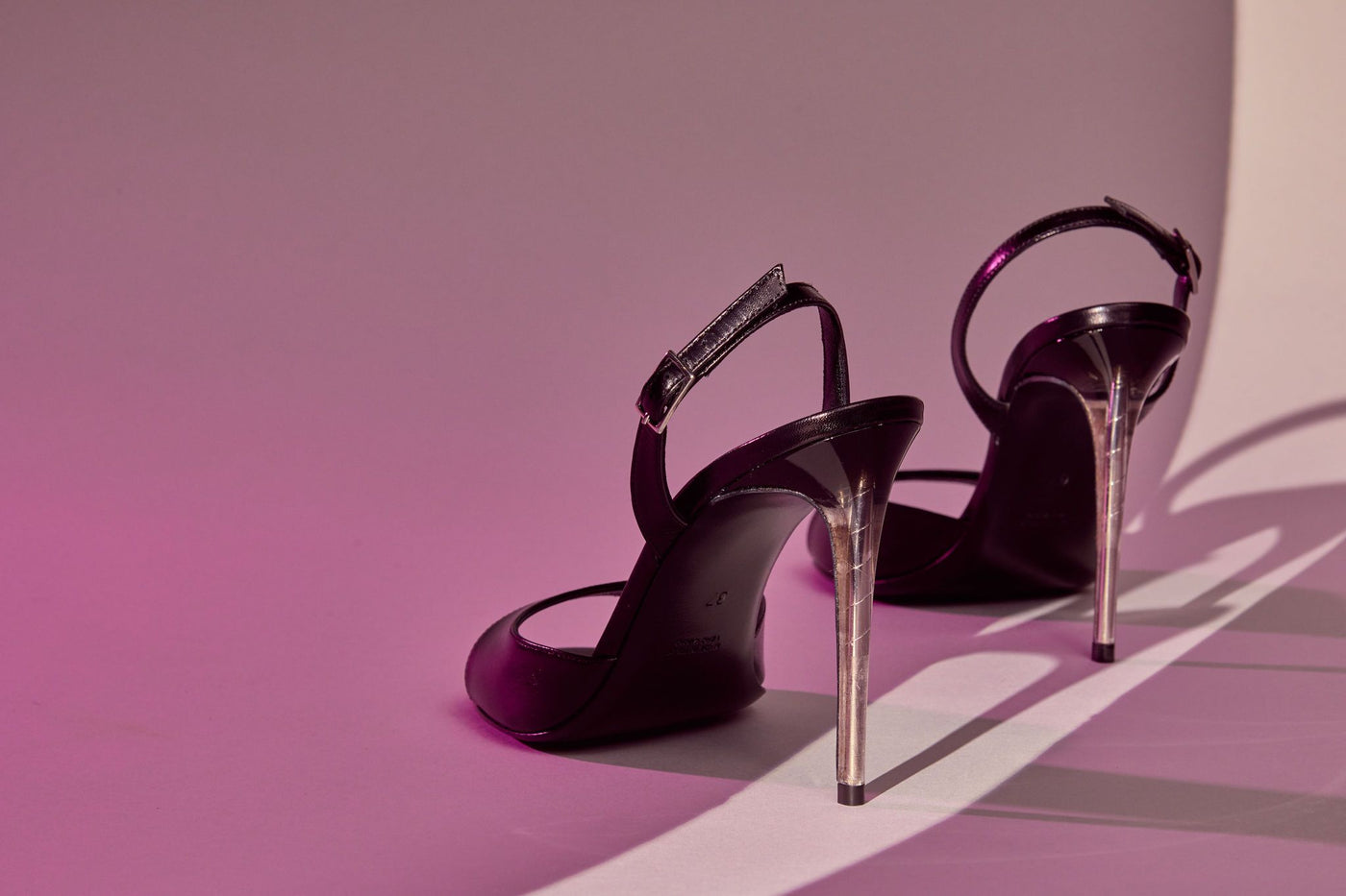 Black leather sandal with transparent PVC heel